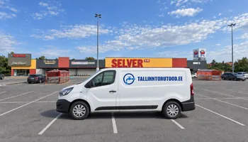 A white van with a water faucet with a circular logo and the letter TALLINNTORUTOOD.EE in front of Peetri Selver on the asphalt with white parking lines, in the utility cabinet of Peetri's apartment building, the plumber installs a water meter with a dial facing the door so that the reading can be read immediately when the cabinet door is opened.
