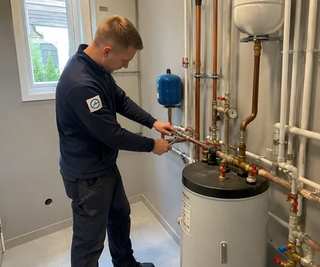 The plumber connects the pipes above the water heater tank, the plumber installs a thermostatic mixer on the hot water outlet of the water heater, which limits the water going to the taps to 50 degrees.